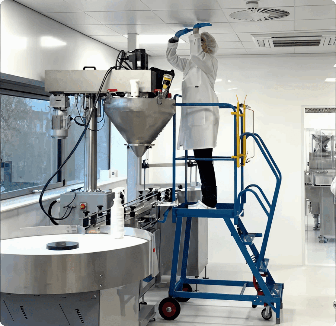 Scientist adjusting machinery in lab