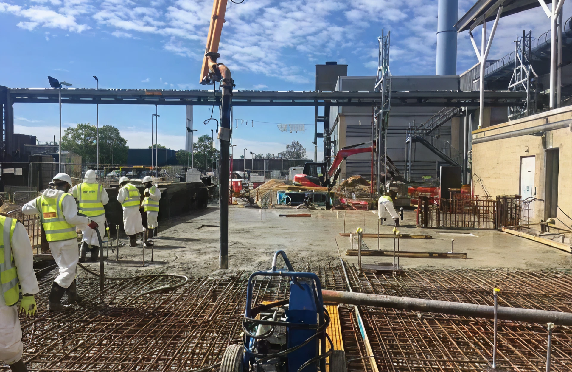 Building site with active concrete pouring.